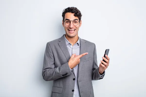 Hispanic Handsome Man Looking Excited Surprised Pointing Side Business Phone — Stock Photo, Image