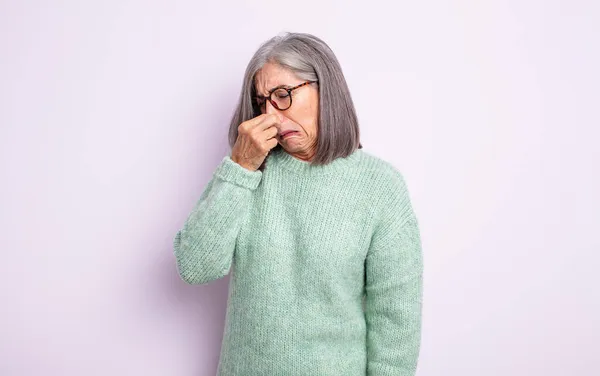 Senior Pretty Woman Feeling Disgusted Holding Nose Avoid Smelling Foul — Stock Photo, Image