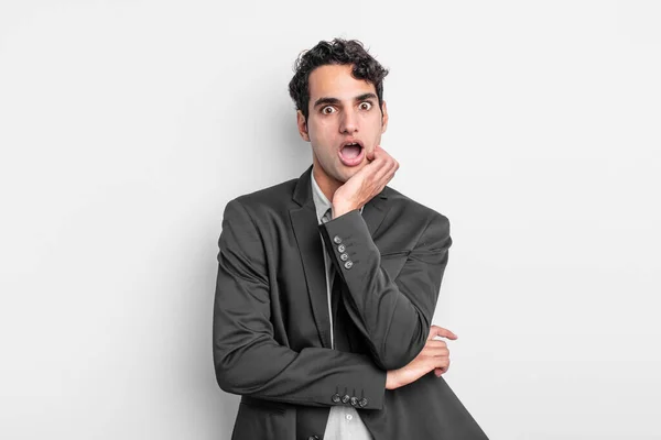 Young Businessman Open Mouthed Shock Disbelief Hand Cheek Arm Crossed — Stock Photo, Image