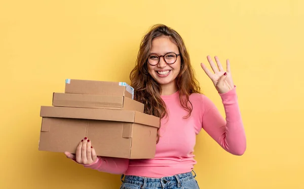 Hispanic Pretty Woman Smiling Looking Friendly Showing Number Four Storage — Stock Photo, Image