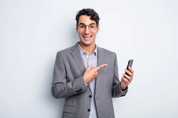 Hispanic Handsome Man Looking Excited Surprised Pointing Side Business Phone — Stock Photo, Image