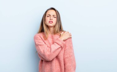 pretty caucasian woman feeling tired, stressed, anxious, frustrated and depressed, suffering with back or neck pain