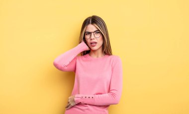 pretty caucasian woman feeling stressed, frustrated and tired, rubbing painful neck, with a worried, troubled look