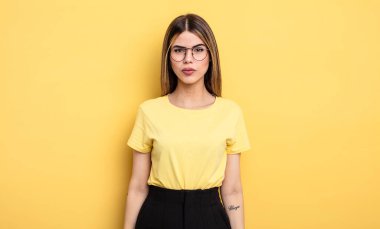 pretty caucasian woman feeling confused and doubtful, wondering or trying to choose or make a decision