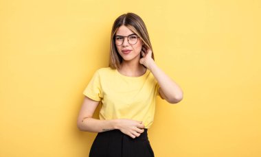 pretty caucasian woman feeling stressed, frustrated and tired, rubbing painful neck, with a worried, troubled look