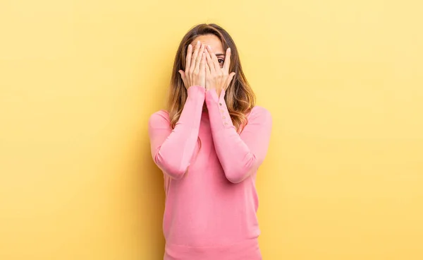 Pretty Caucasian Woman Covering Face Hands Peeking Fingers Surprised Expression — Stok fotoğraf