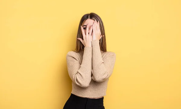 Pretty Caucasian Woman Covering Face Hands Peeking Fingers Surprised Expression — Stok fotoğraf