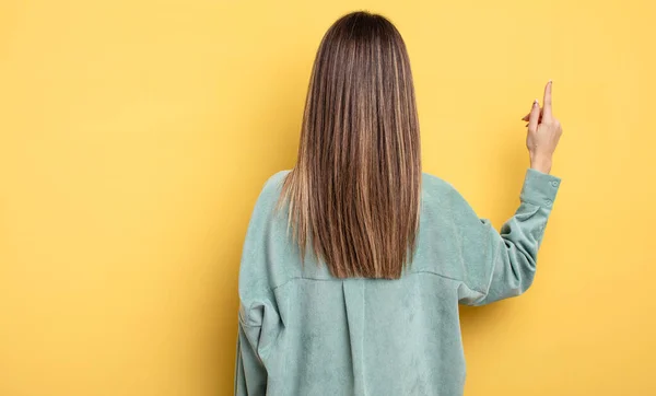 Pretty Caucasian Woman Standing Pointing Object Copy Space Rear View — Stock Photo, Image