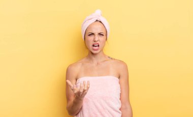 pretty woman looking angry, annoyed and frustrated. shower and beauty concept