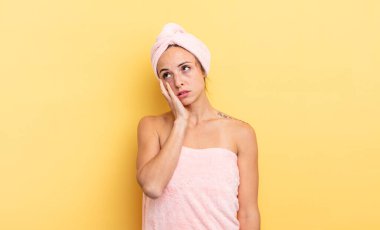 pretty woman feeling bored, frustrated and sleepy after a tiresome. shower and beauty concept