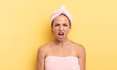 pretty woman shouting aggressively, looking very angry. shower and beauty concept