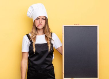 chef woman looking puzzled and confused. blackboard menu concept