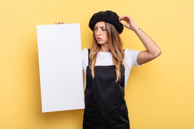 woman artist feeling puzzled and confused, scratching head empty canvas concept