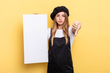 woman artist feeling cross,showing thumbs down empty canvas concept