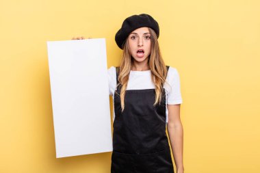 woman artist looking very shocked or surprised empty canvas concept