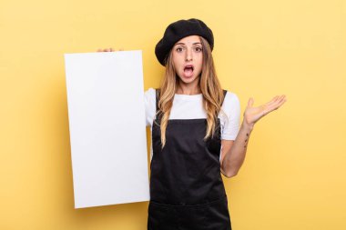 woman artist feeling happy and astonished at something unbelievable empty canvas concept