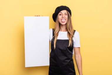 woman artist with cheerful and rebellious attitude, joking and sticking tongue out empty canvas concept