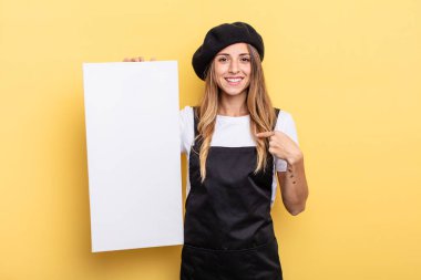 woman artist feeling happy and pointing to self with an excited empty canvas concept