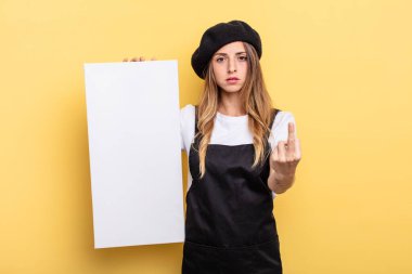 woman artist feeling angry, annoyed, rebellious and aggressive empty canvas concept