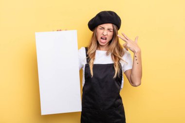 woman artist looking unhappy and stressed, suicide gesture making gun sign empty canvas concept
