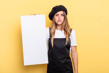 woman artist looking puzzled and confused empty canvas concept