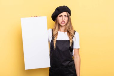 woman artist feeling puzzled and confused empty canvas concept