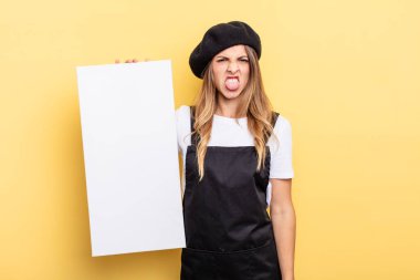 woman artist feeling disgusted and irritated and tongue out empty canvas concept