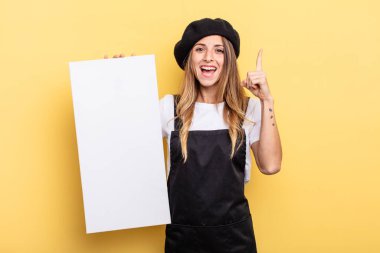 woman artist feeling like a happy and excited genius after realizing an idea empty canvas concept