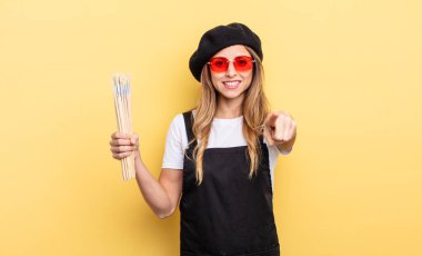 artist painter pointing at camera choosing you