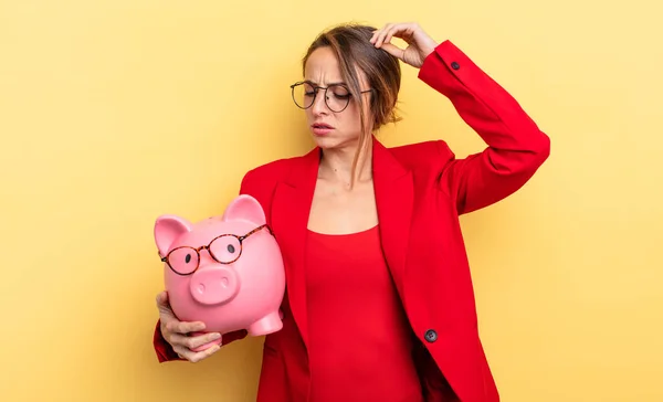 Businesswoman Feeling Puzzled Confused Scratching Head Piggy Bank Concept — Stock fotografie