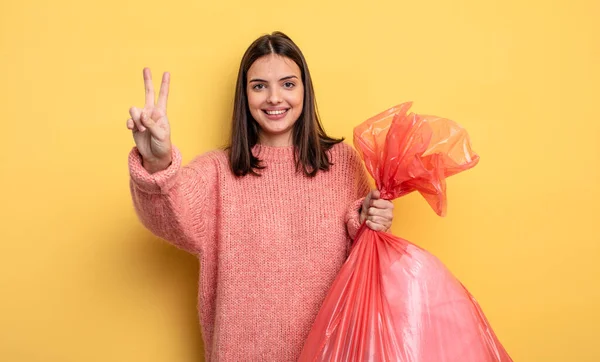 Pretty Woman Smiling Looking Happy Gesturing Victory Peace Trash Bag — Stok fotoğraf
