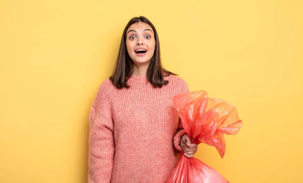 Pretty Woman Looking Happy Pleasantly Surprised Trash Bag Concept — Stok fotoğraf