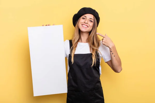 Woman Artist Smiling Confidently Pointing Own Broad Smile Empty Canvas — Stockfoto