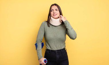 pretty woman feeling stressed, anxious, tired and frustrated. accident injured concept