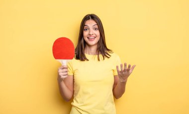 pretty woman feeling happy, surprised realizing a solution or idea. ping pong concept