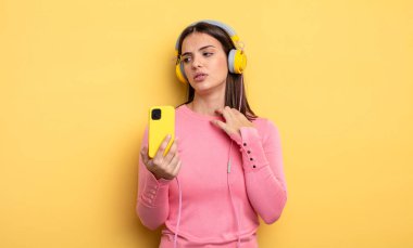 pretty woman feeling stressed, anxious, tired and frustrated. listening music concept