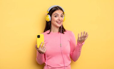 pretty woman feeling happy, surprised realizing a solution or idea. listening music concept