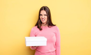 pretty woman feeling puzzled and confused. white box packaging concept