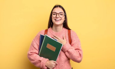 pretty student woman laughing out loud at some hilarious joke