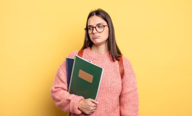 pretty student woman feeling sad, upset or angry and looking to the side