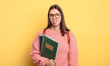 pretty student woman feeling disgusted and irritated and tongue out