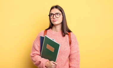 pretty student woman thinking, feeling doubtful and confused