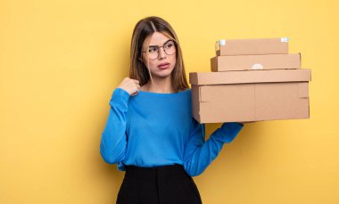 pretty woman feeling stressed, anxious, tired and frustrated packages boxes concept
