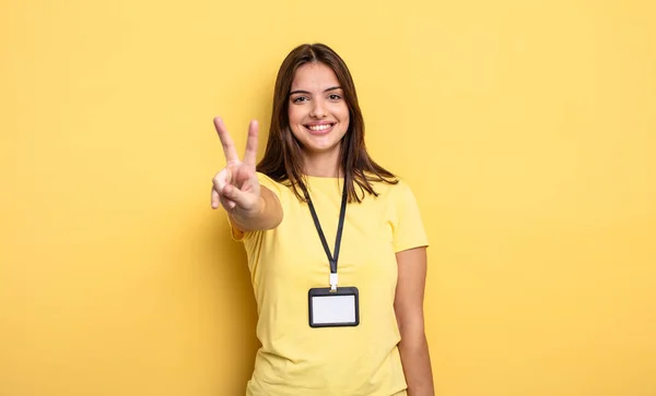 Pretty Woman Smiling Looking Happy Gesturing Victory Peace Accreditation Card — Stockfoto