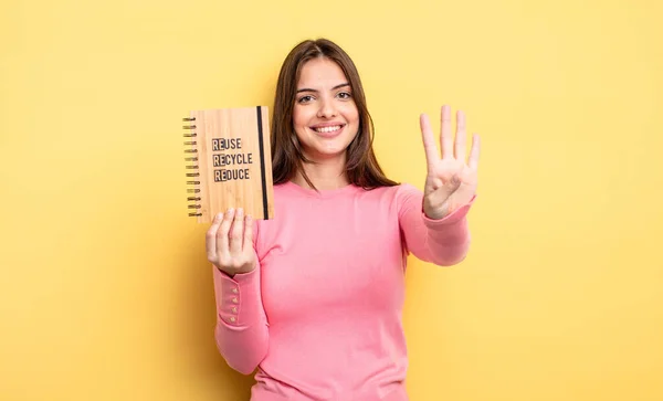 Pretty Woman Smiling Looking Friendly Showing Number Four Recycle Concept — Stockfoto