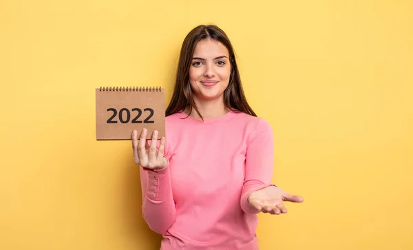 Pretty Woman Smiling Happily Friendly Offering Showing Concept 2022 Calendar — Stockfoto