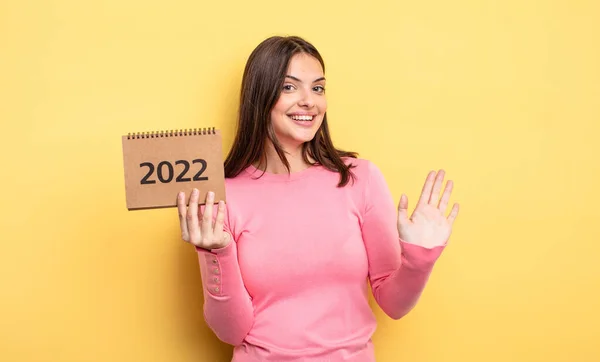 Pretty Woman Smiling Happily Waving Hand Welcoming Greeting You 2022 — Stockfoto