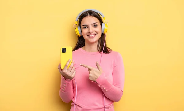 Pretty Woman Smiling Cheerfully Feeling Happy Pointing Side Listening Music — Stock Photo, Image