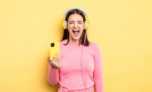 Pretty Woman Shouting Aggressively Looking Very Angry Listening Music Concept —  Fotos de Stock