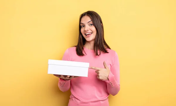 Pretty Woman Looking Excited Surprised Pointing Side White Box Packaging — Stock Fotó